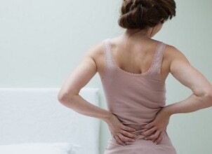 Боли в пояснице при беременности: естественные и опасные причины